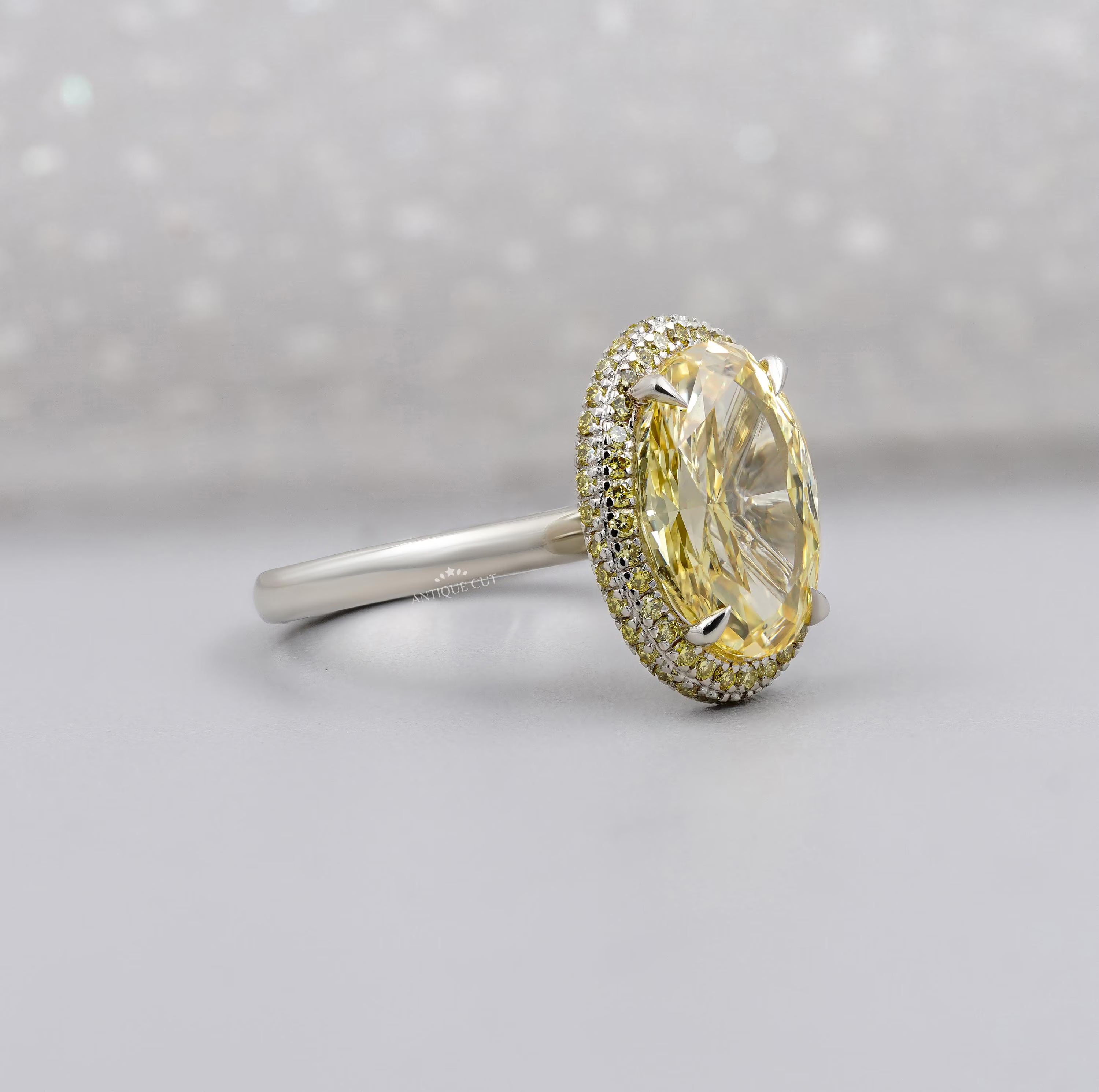 Yellow oval diamond halo ring with double halo setting