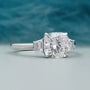 Cushion cut diamond engagement ring with baguette side stones