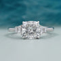 Cushion Cut Center Stone Engagement Ring With Tapered Baguette Side Stones