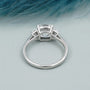 Modern lab grown cushion cut diamond engagement ring with sleek white gold setting.