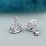 Oval diamond studs on soft background, premium jewelry