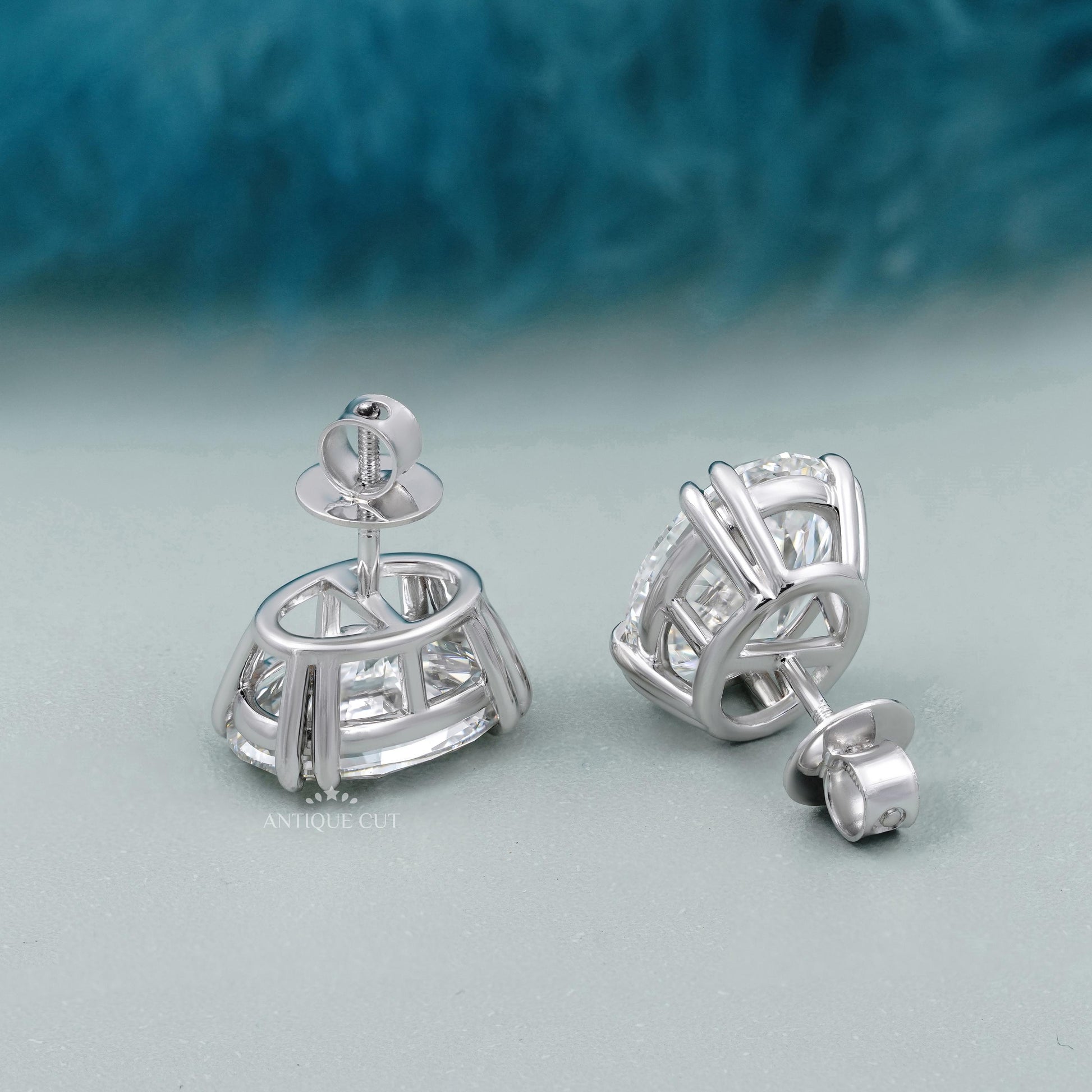 Oval diamond studs on soft background, premium jewelry