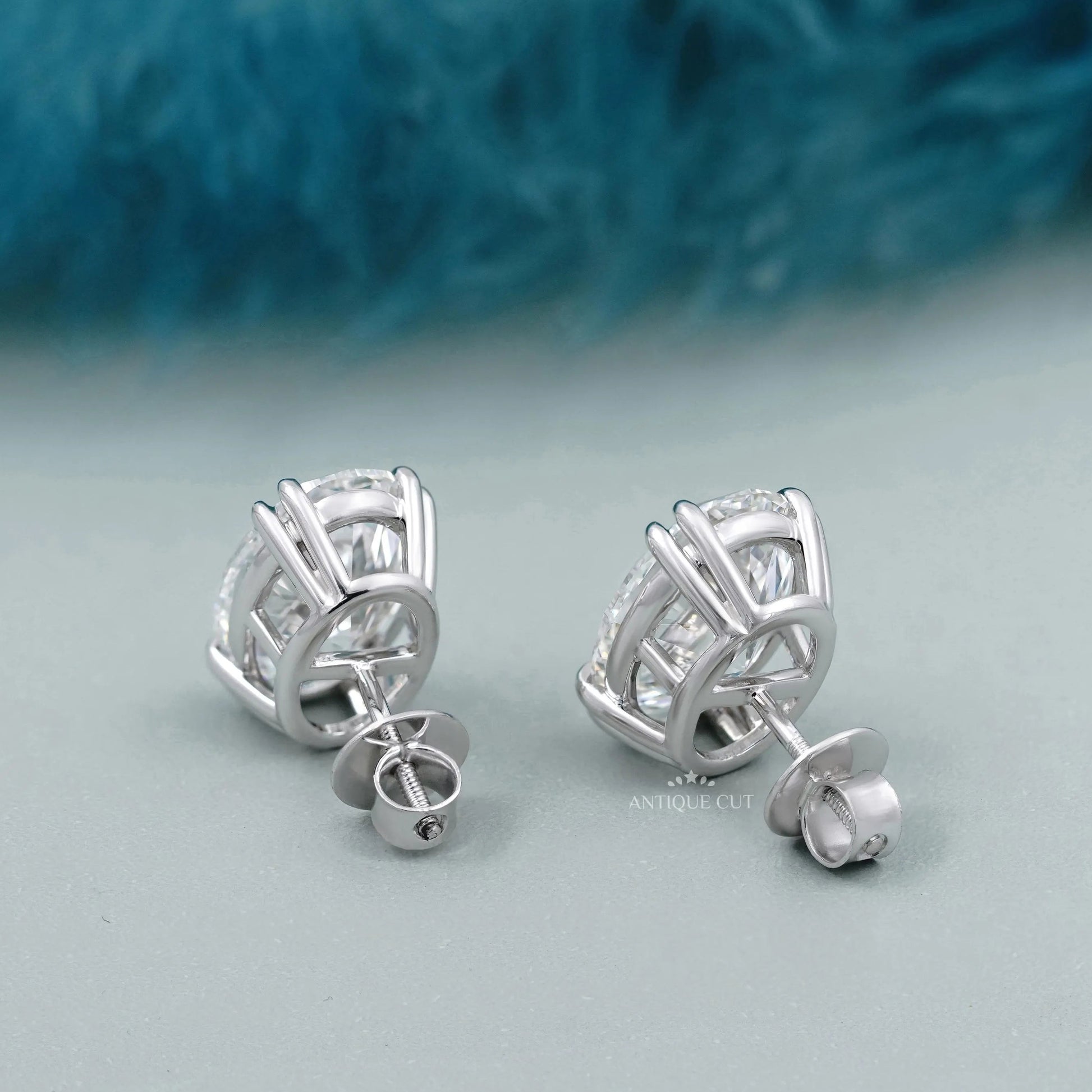 Side profile of white gold oval stud earrings