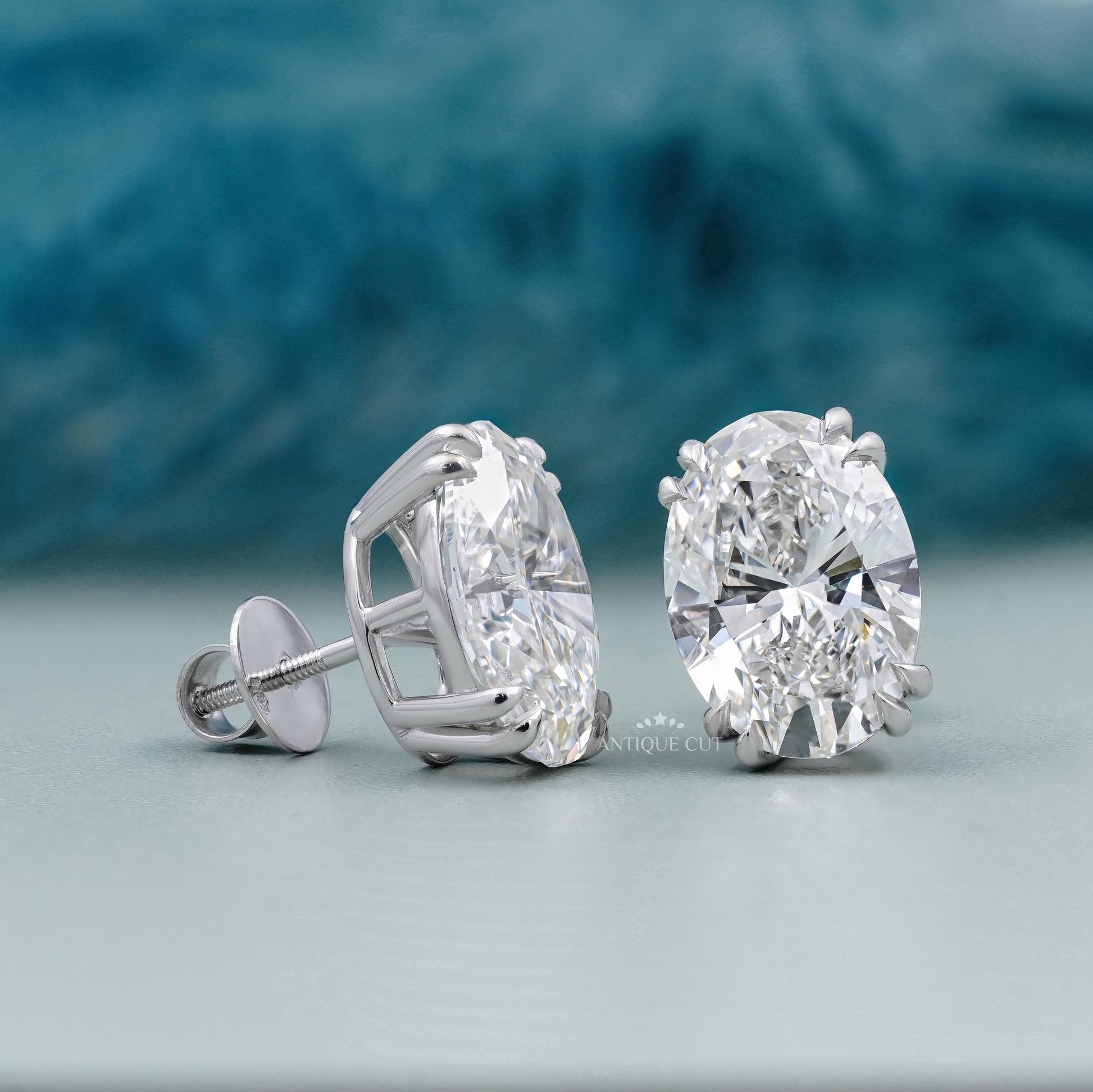 Pair of oval stud earrings with double prong setting