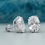 Front view of oval diamond stud earrings with claw double prongs