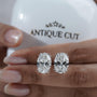 White gold oval stud earrings highlighting diamond brilliance