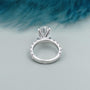Oval center stone engagement ring with diamond shoulders