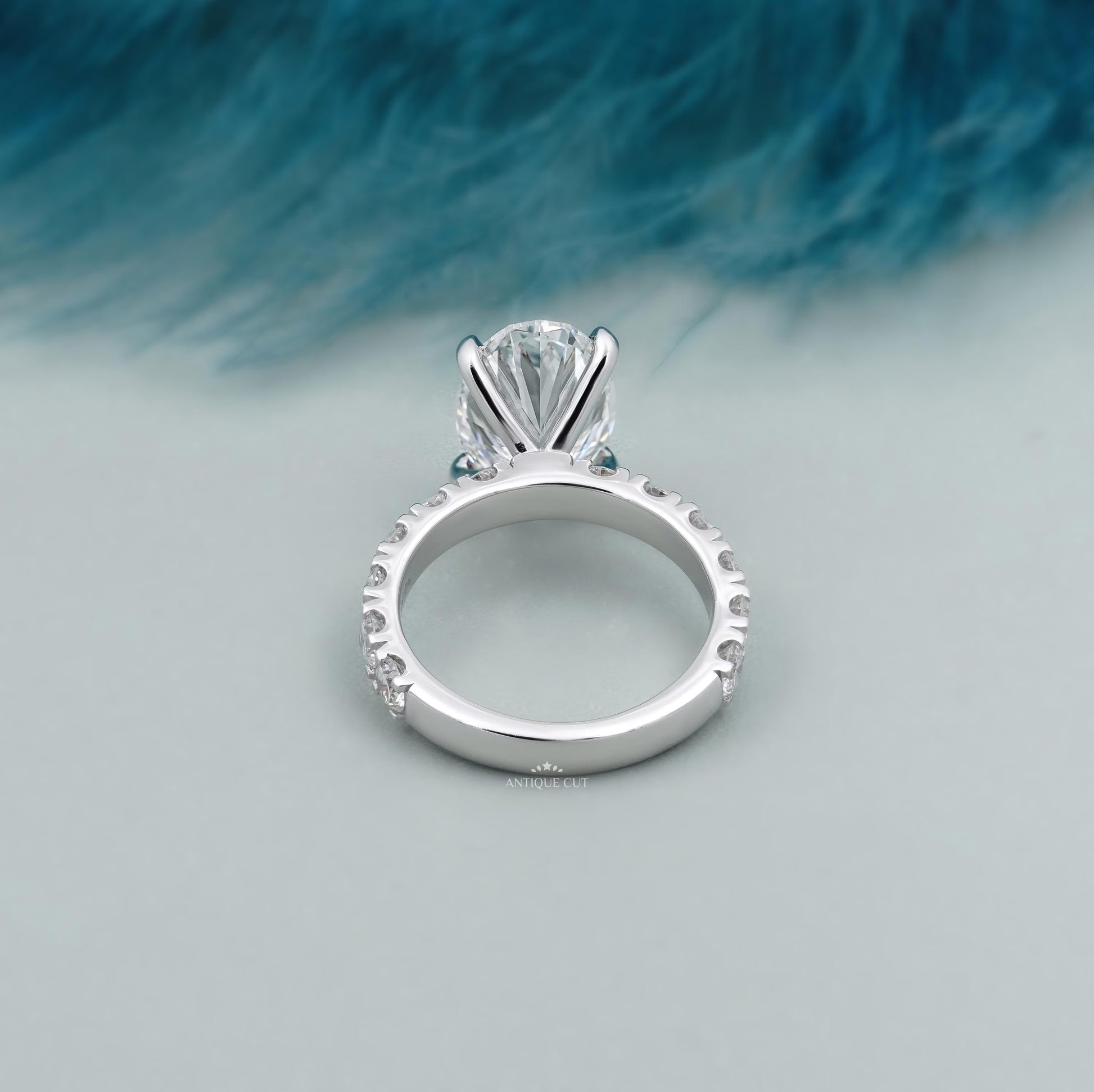 Elegant oval cut engagement ring with diamond accented shank