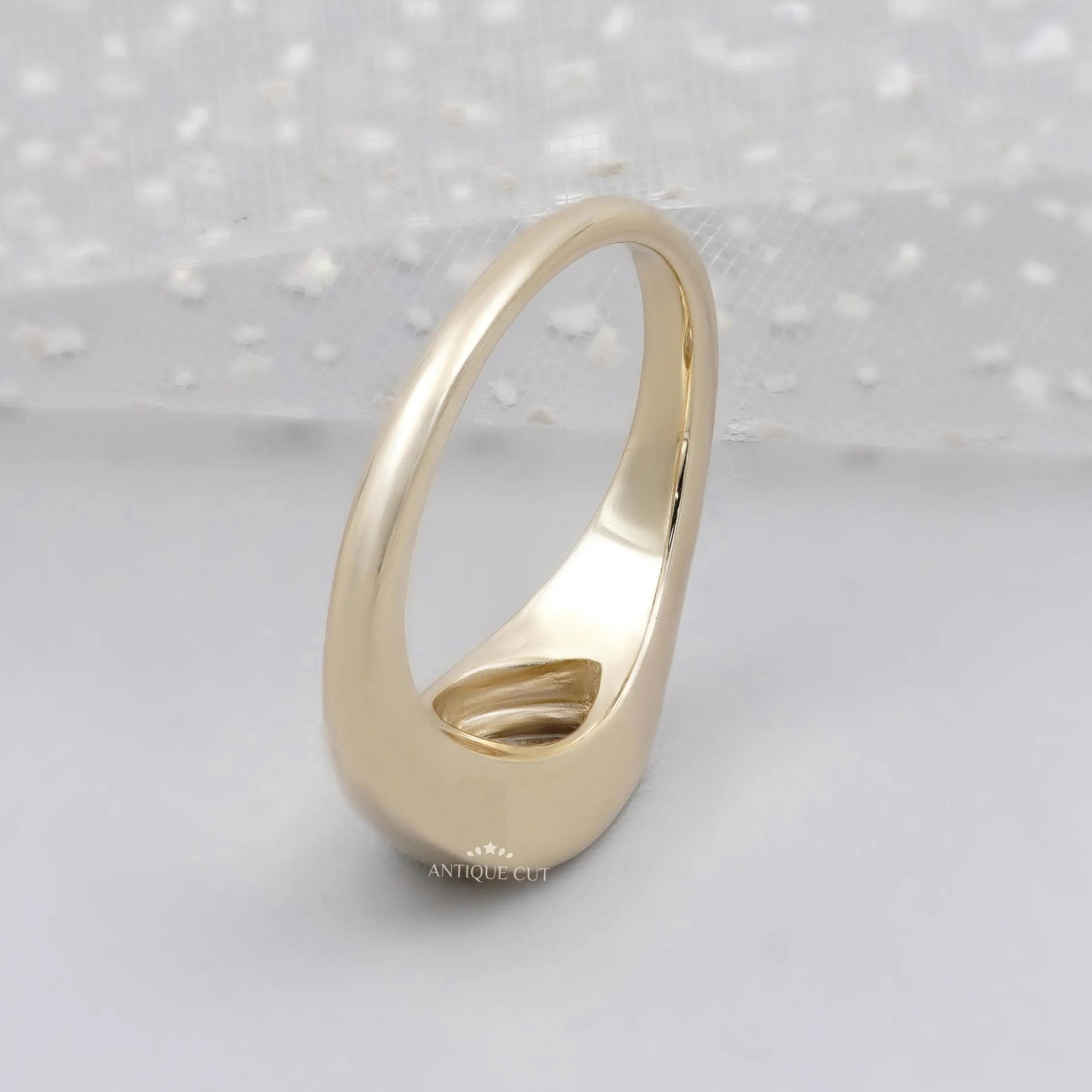 Pear cut diamond secured in a full yellow gold bezel