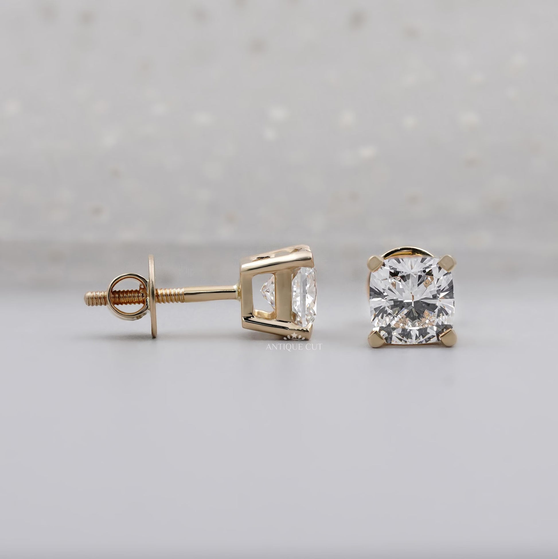 Cushion diamond stud earrings close-up view