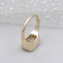 Unique horizontal emerald diamond signet ring with bezel setting