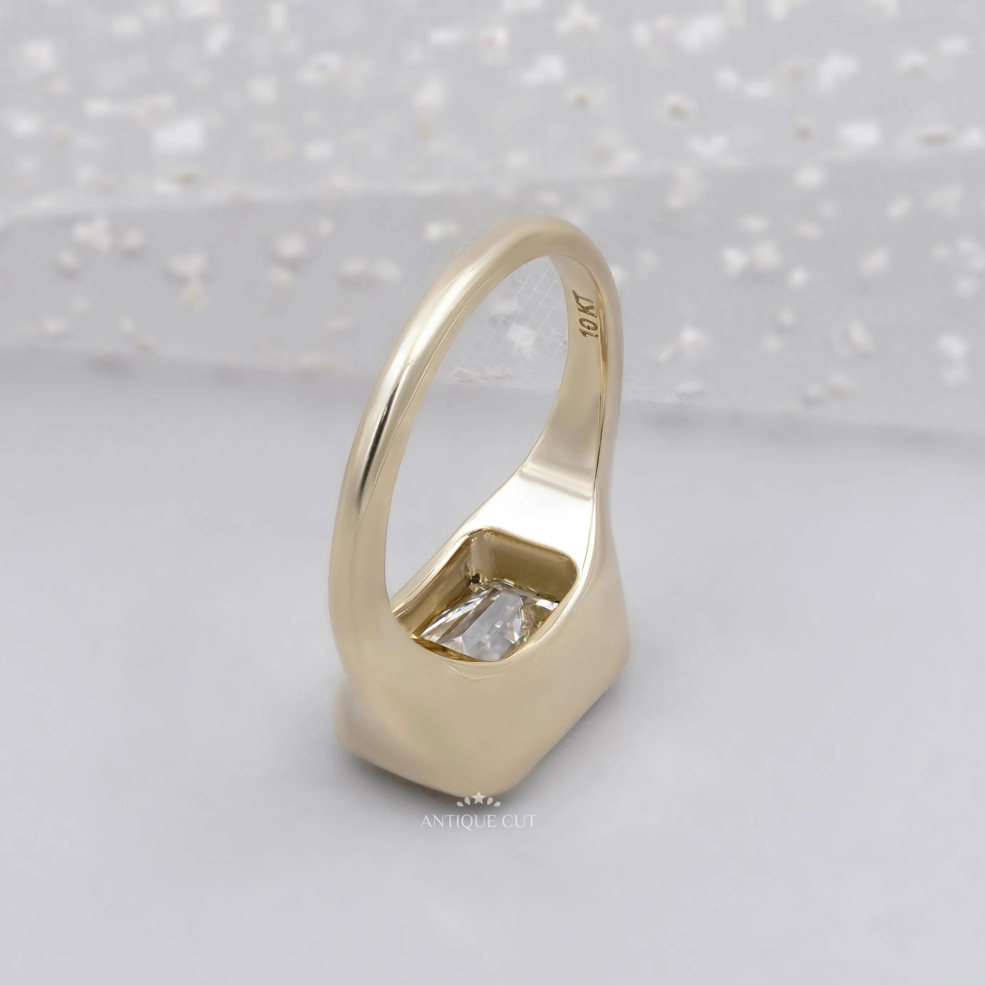 Unique horizontal emerald diamond signet ring with bezel setting