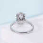 Oval solitaire engagement ring with 4 prong setting in white gold
