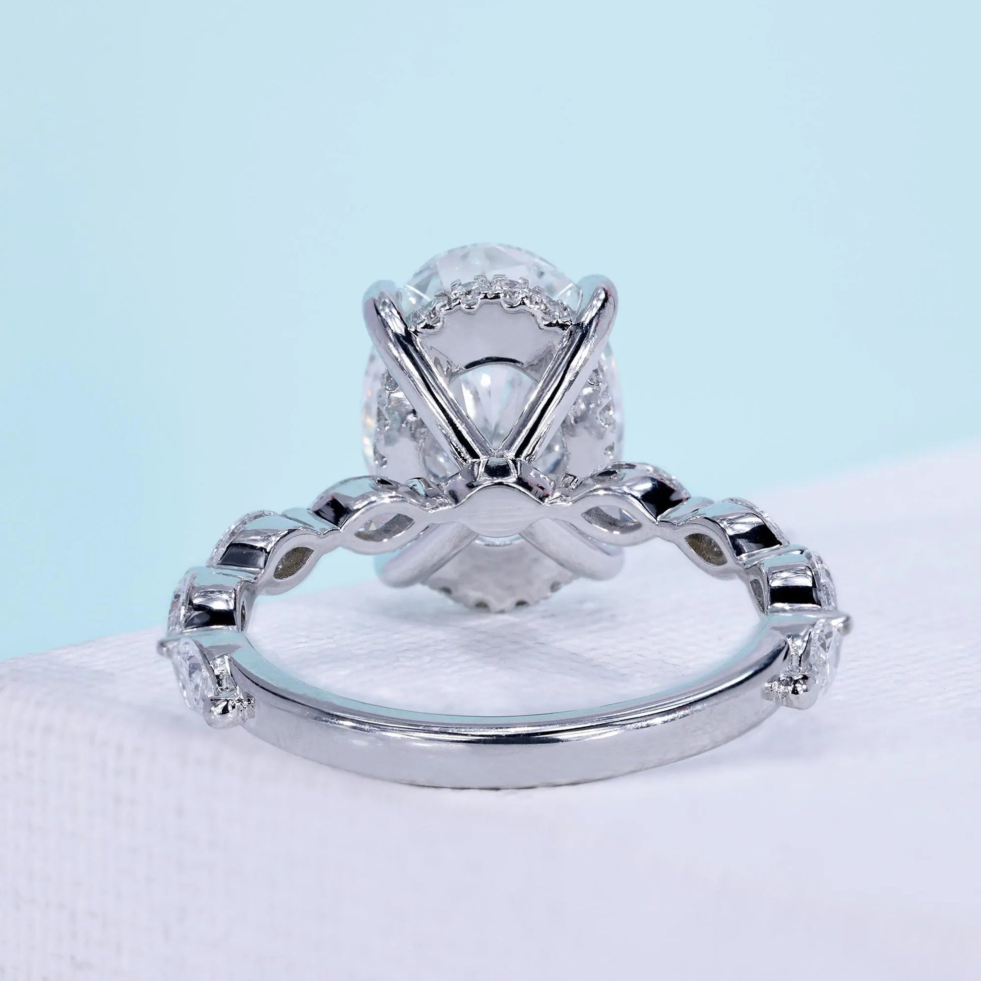 Women’s oval diamond ring with marquise cut side stones
