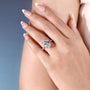 White gold engagement ring featuring oval center diamond and hidden halo
