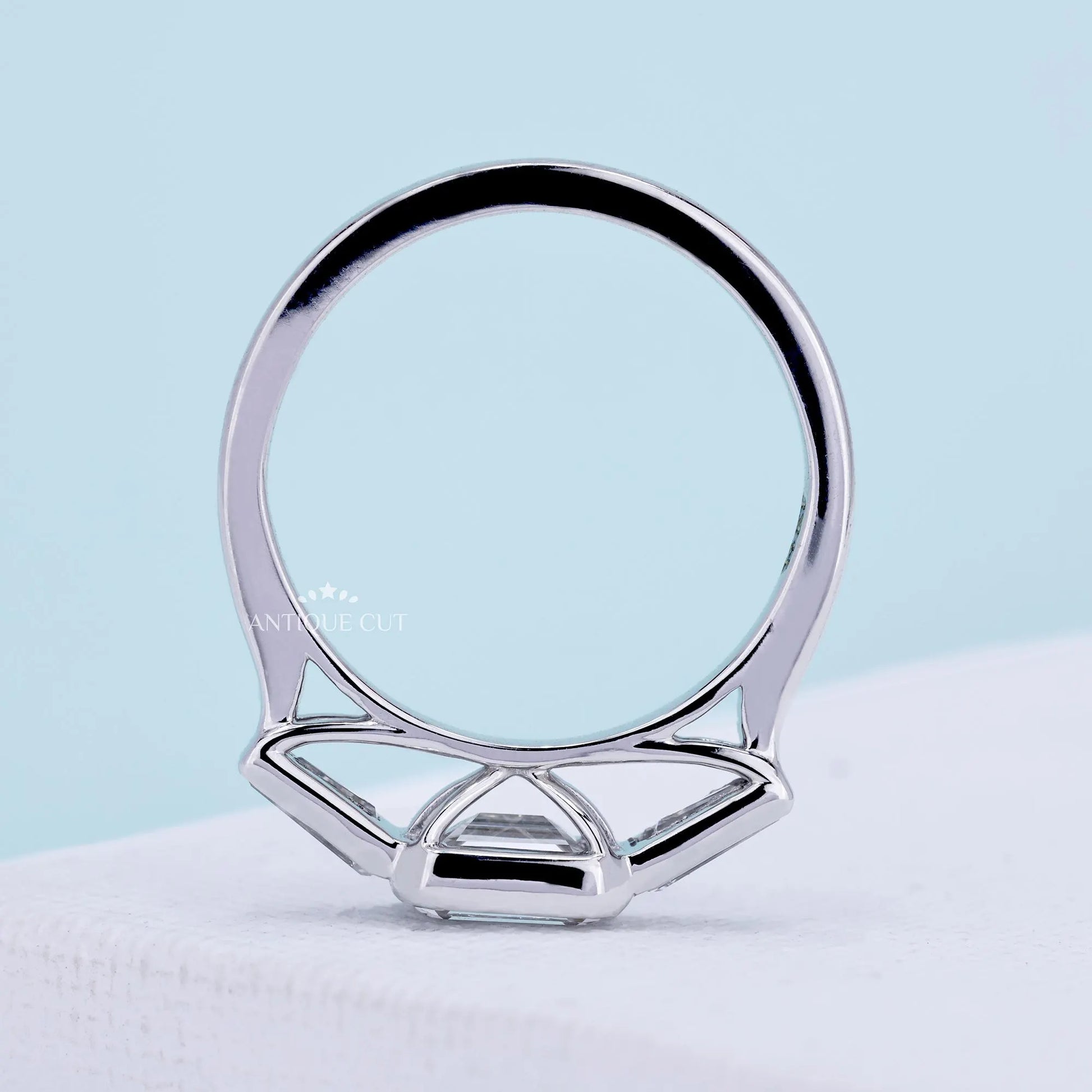 IGI certified emerald cut east west engagement ring in white gold
