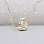 Yellow gold rabbit shape pendant with diamond
