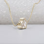 Yellow gold rabbit shape pendant with diamond