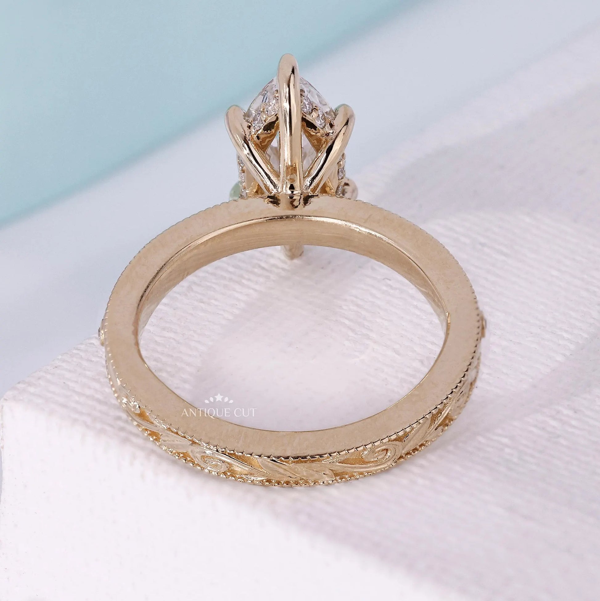 Antiquecut vintage marquise diamond ring with hidden halo design
