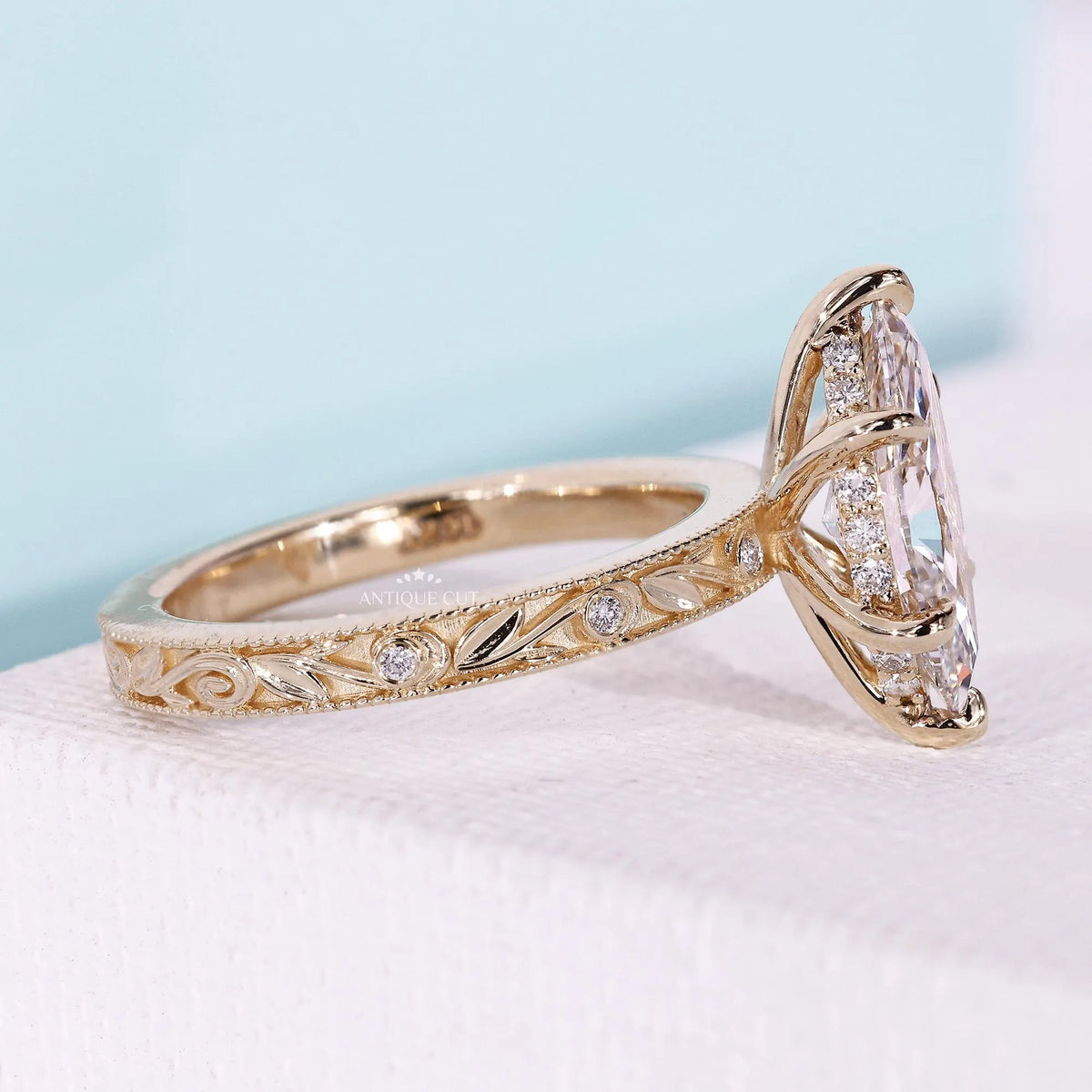 Marquise cut diamond ring featuring hidden halo vintage design
