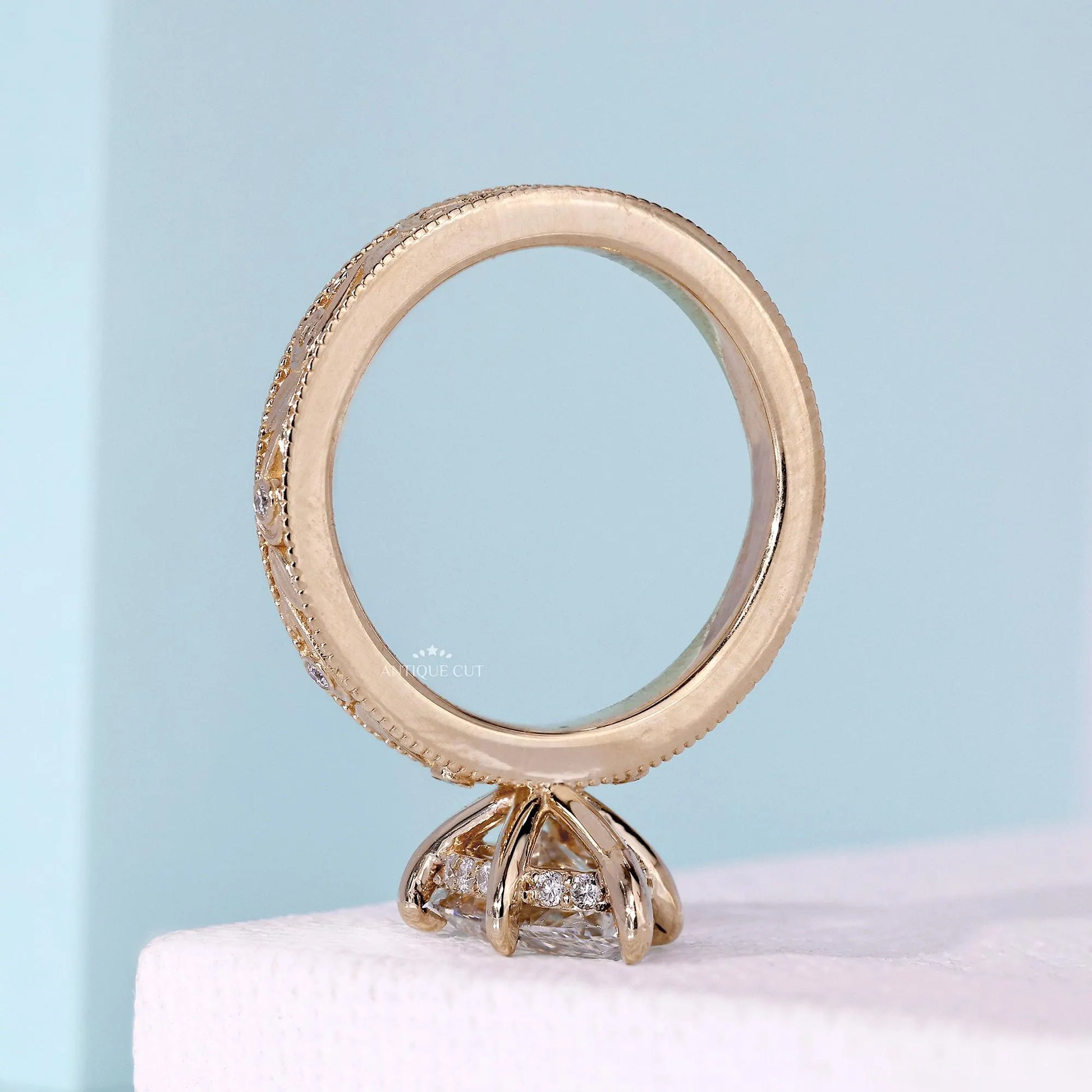 Yellow gold engagement ring with milgrain vintage finish
