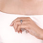 Women’s oval diamond ring with marquise floral side stones
