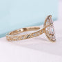 Vintage marquise diamond ring with 6 claw prong setting and side stones