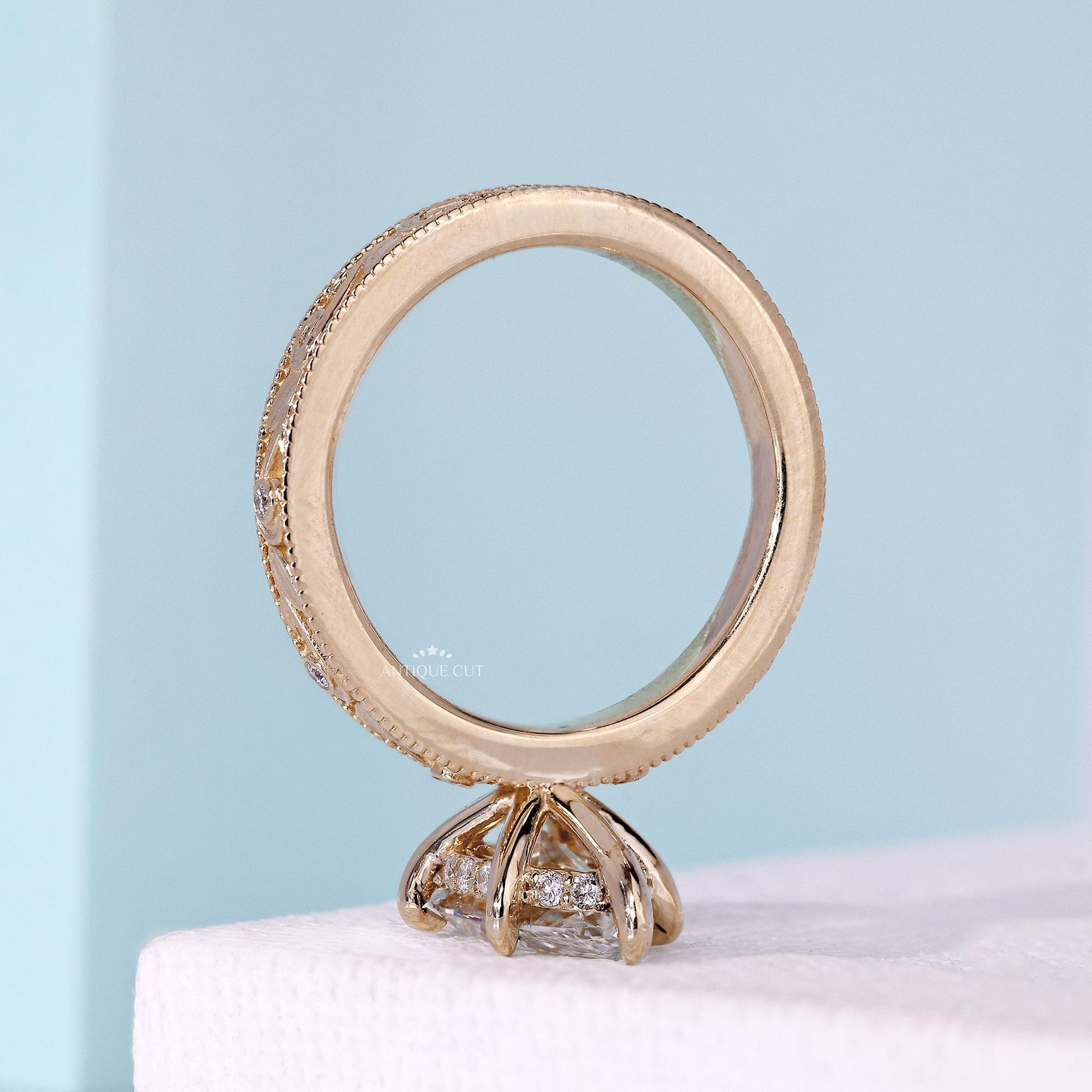 Antiquecut vintage marquise diamond ring with hidden halo design