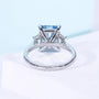 Lab grown radiant cut blue diamond ring with tapered baguette stones