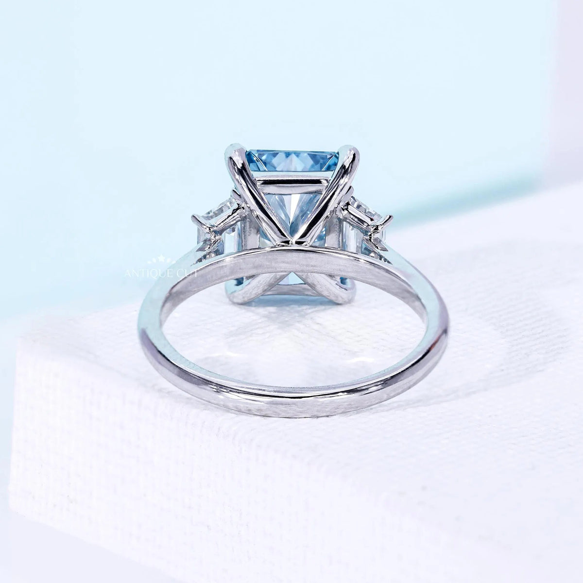 Lab grown radiant cut blue diamond ring with tapered baguette stones