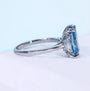White gold radiant cut diamond ring with 4 claw prong setting