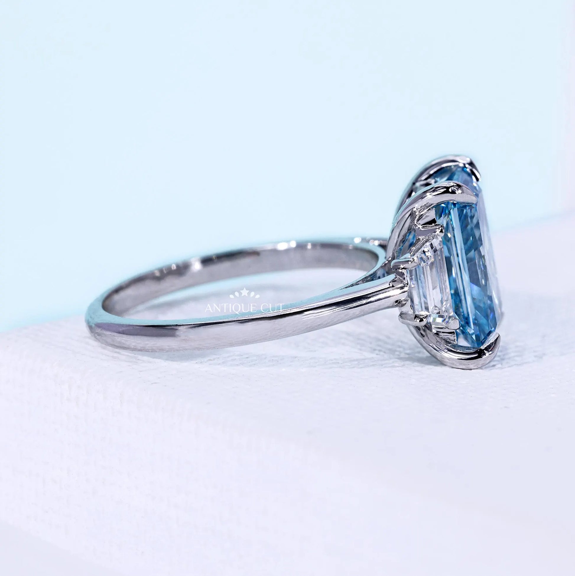 White gold radiant cut diamond ring with 4 claw prong setting