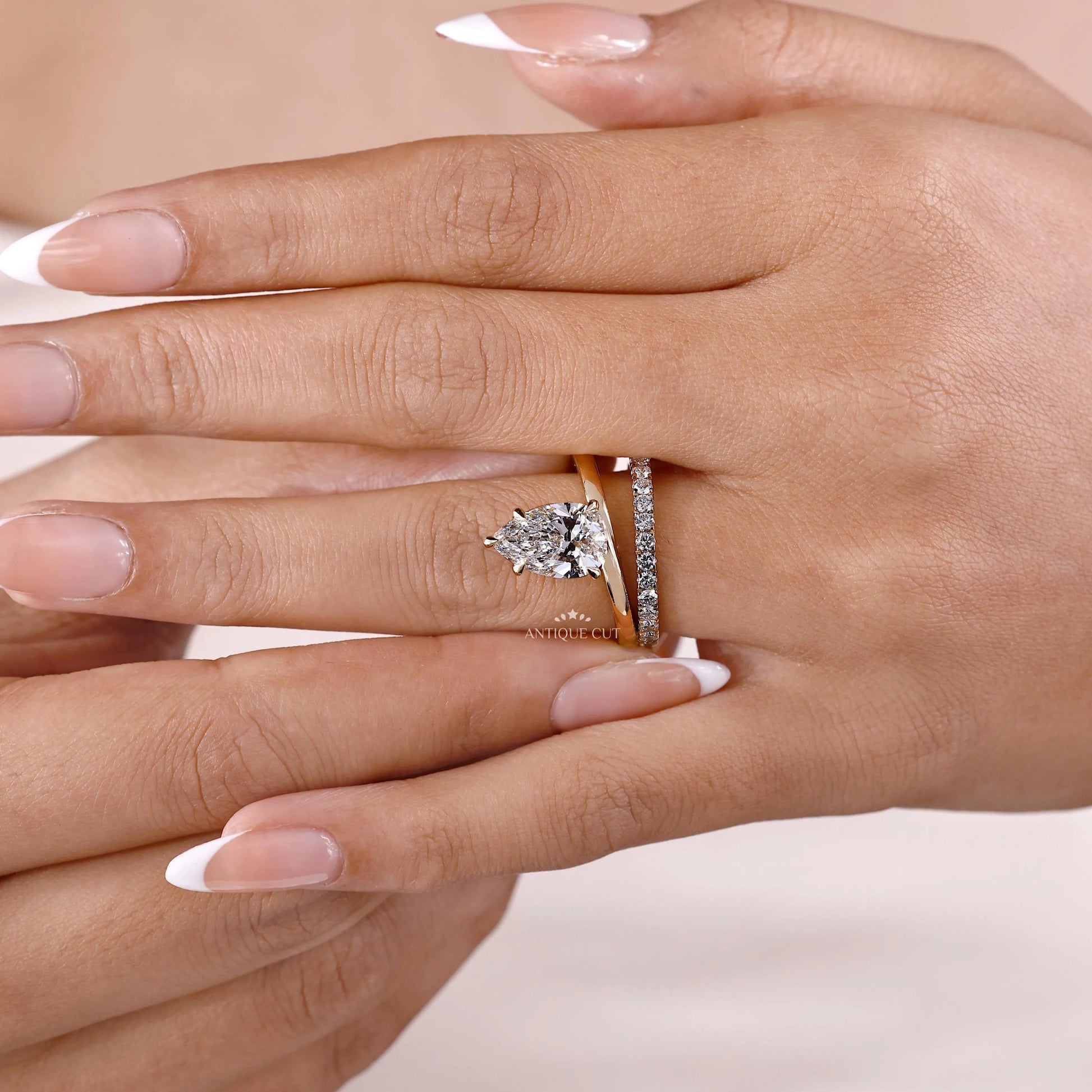 Teardrop diamond engagement ring with double band
