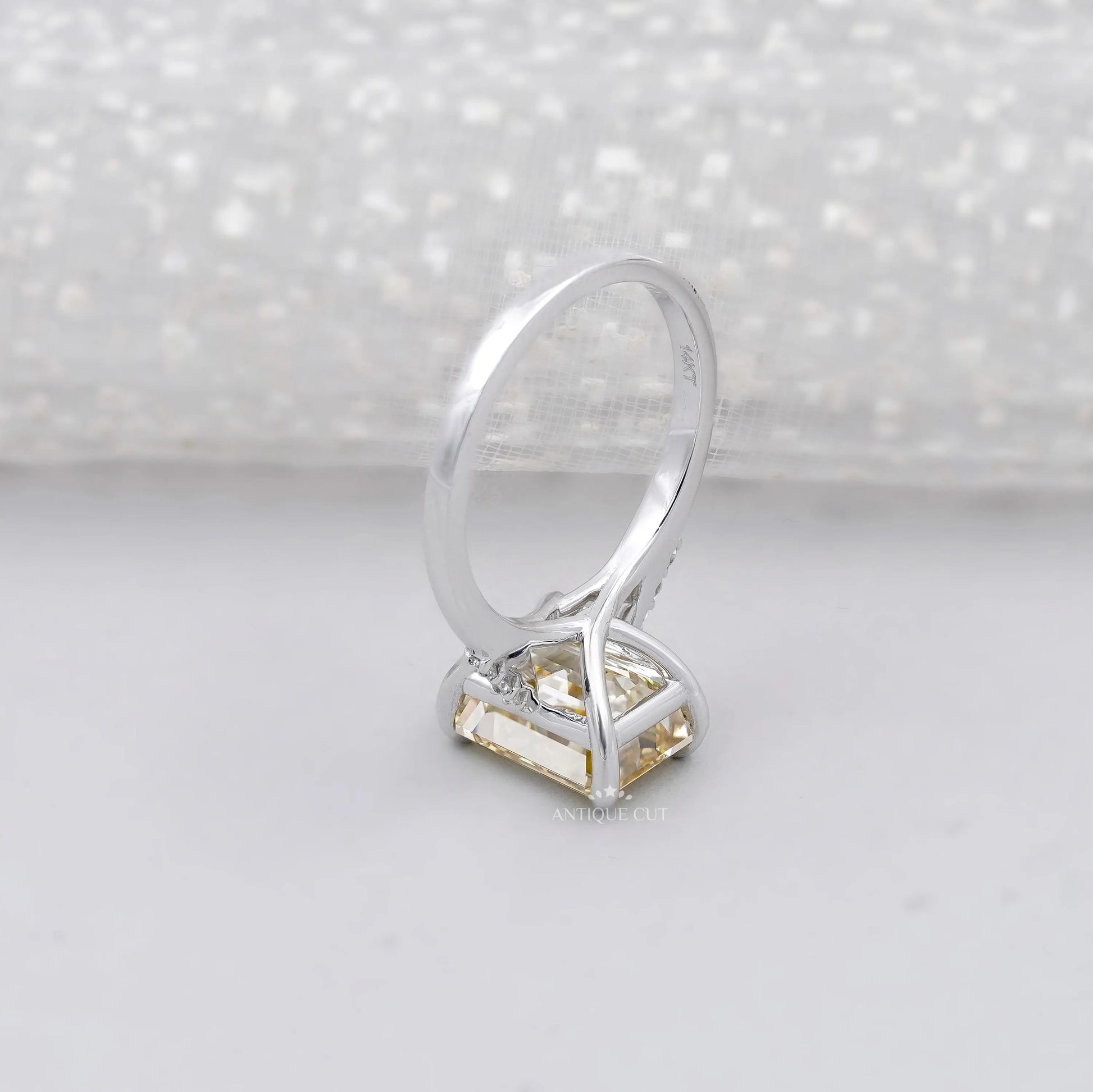 Elegant Yellow Emerald Cut Lab Grown Diamond engagement ring.