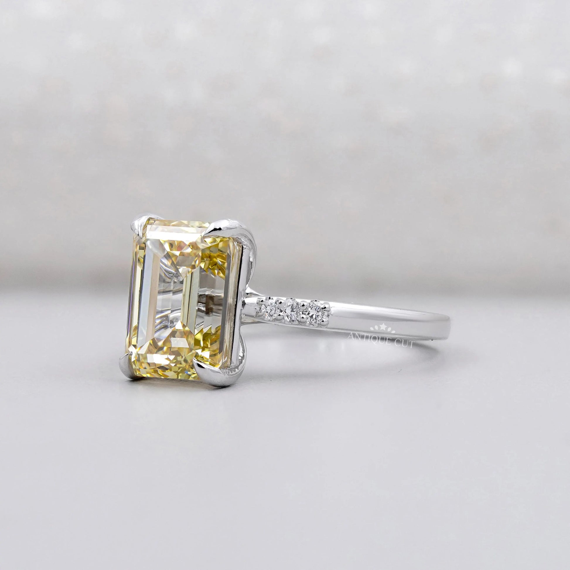 Antiquecut engagement ring featuring a Yellow Emerald Cut Diamond.