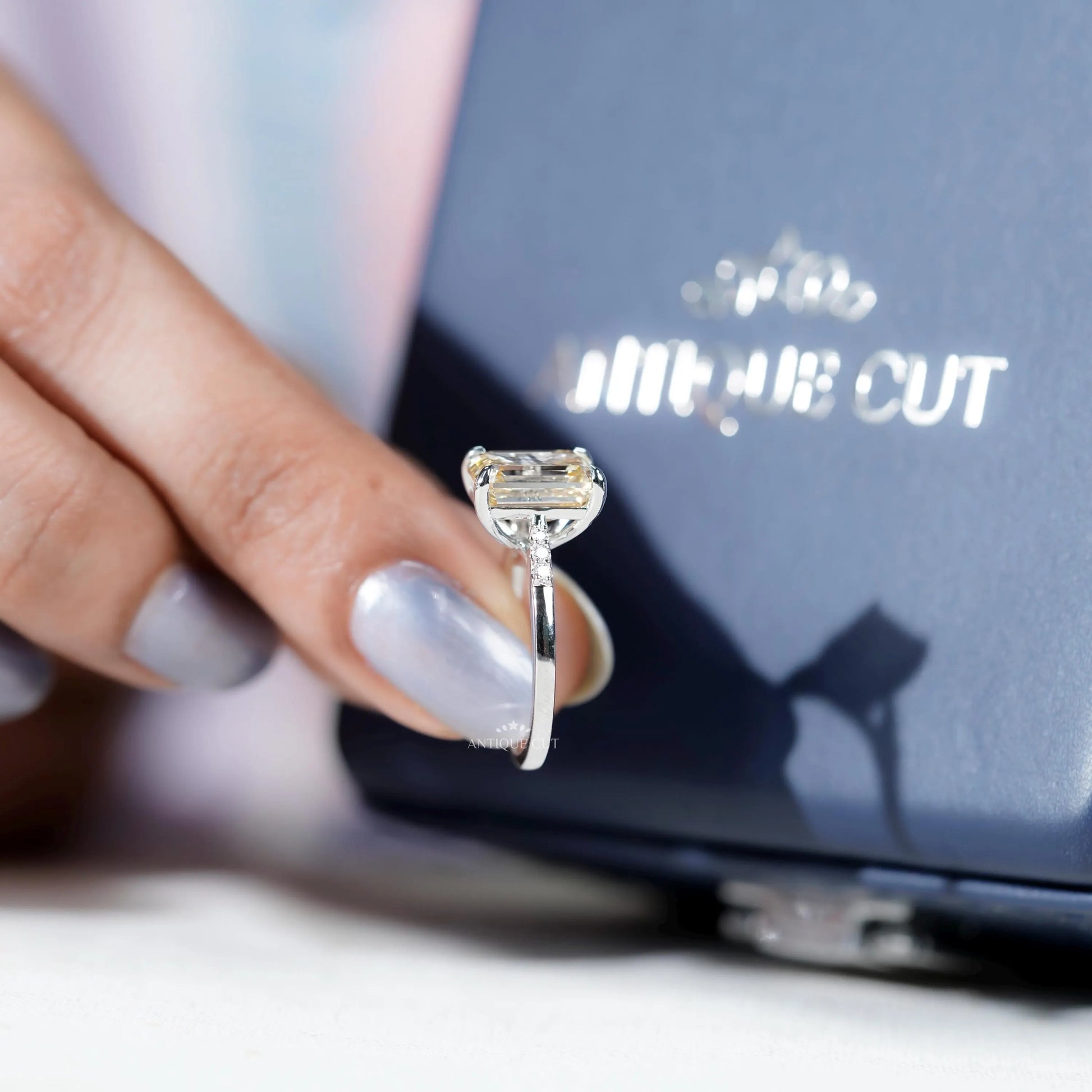 Timeless Yellow Emerald Cut Diamond ring with four-prong setting.