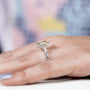 White gold engagement ring with Yellow Emerald Cut Diamond centerpiece.