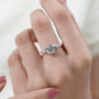 White gold diamond engagement ring with delicate leaf accents