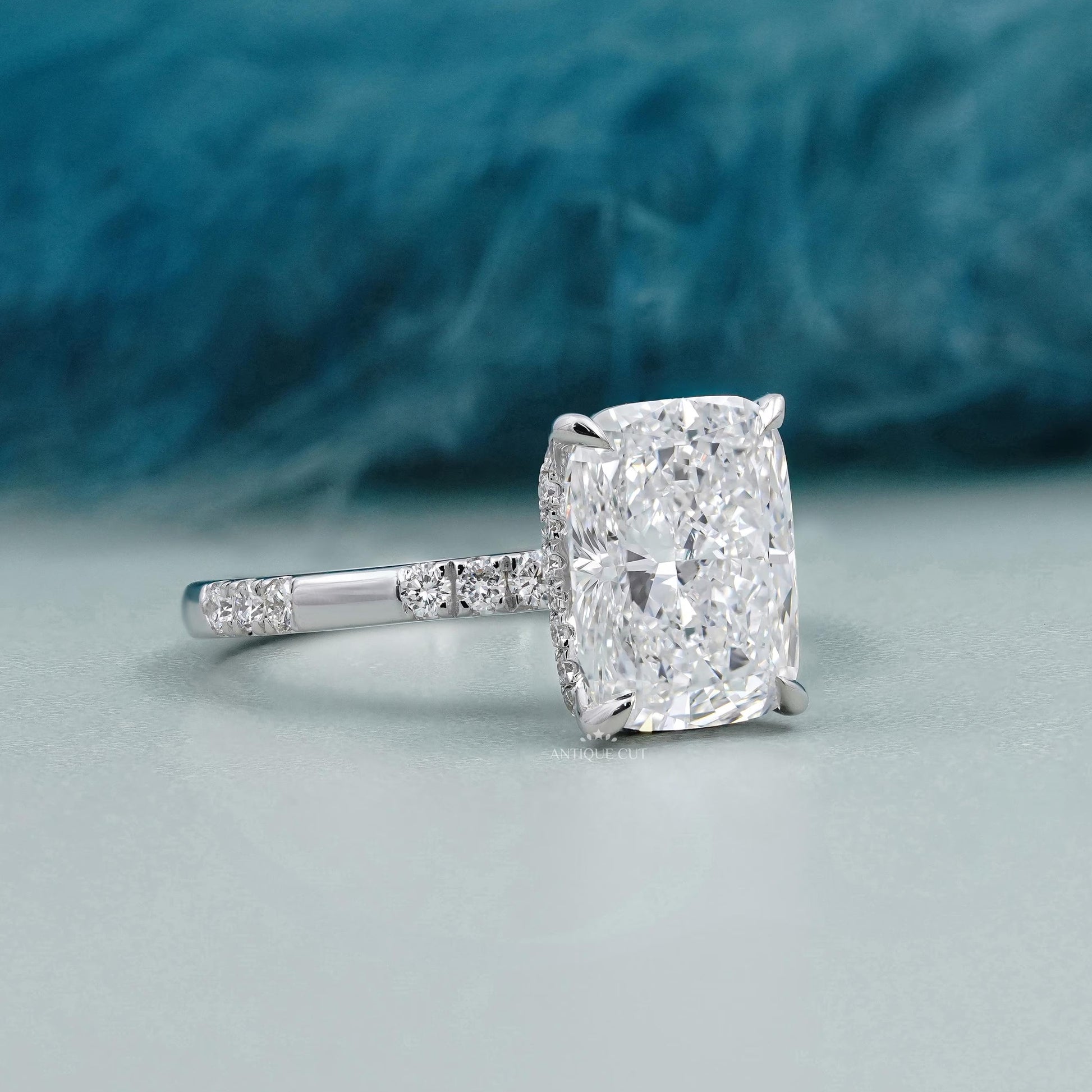 Cushion cut diamond solitaire pave bridal ring with hidden halo