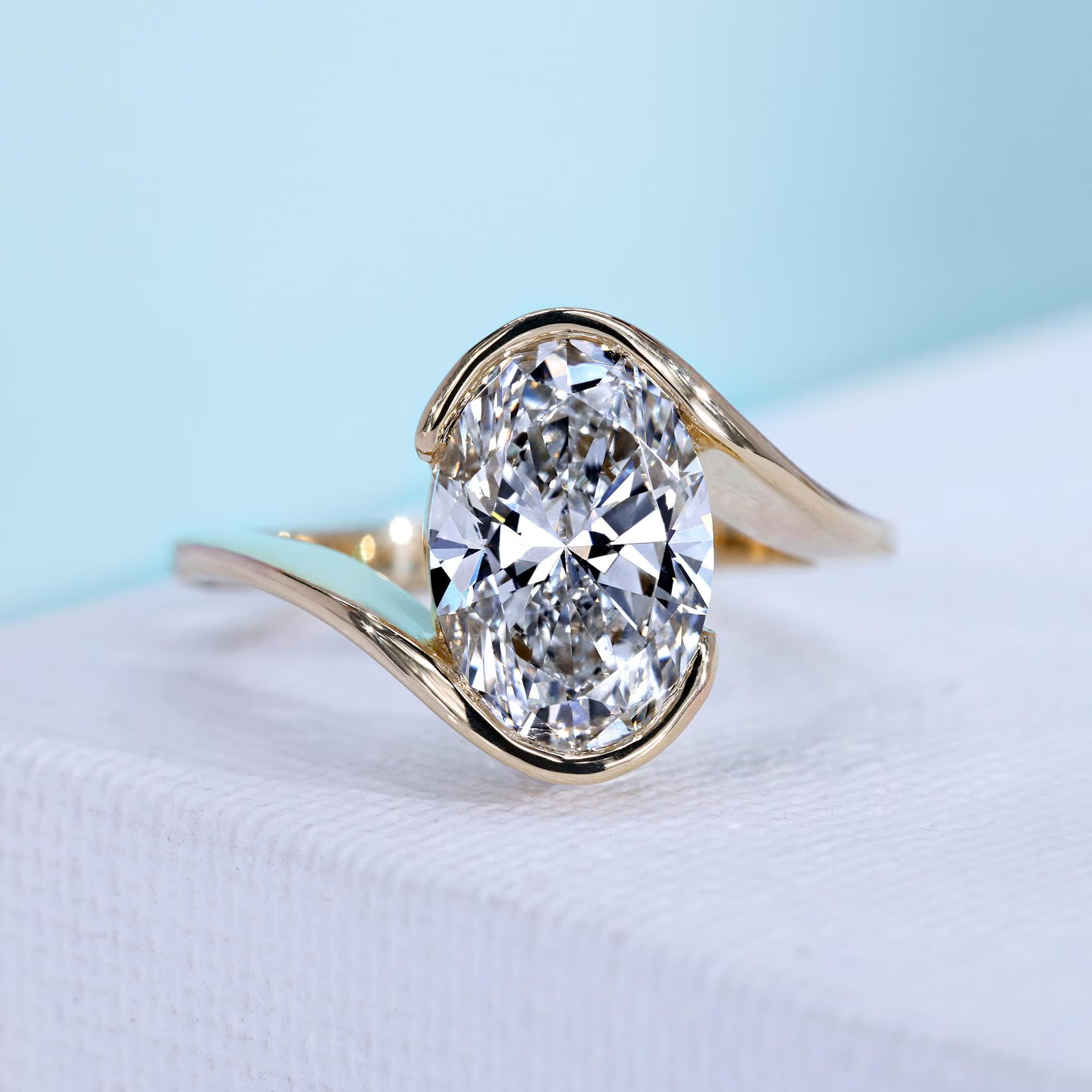 Oval Cut Diamond Bypass Engagement Ring Yellow Gold With Round Diamond Side Stone IGI Certified