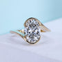 Oval Cut Diamond Bypass Engagement Ring Yellow Gold With Round Diamond Side Stone IGI Certified