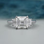 Three Stone Square Emerald Diamond Ring With Tapered Step Cut Side Stones Minimalist Bridal Jewelry