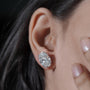 Oval stud earrings angled to show diamond sparkle