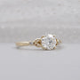 Romantic white gold diamond ring with botanical accents