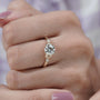 Round diamond solitaire ring with decorative side details