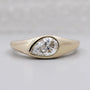 Pear cut lab grown diamond signet ring in yellow gold