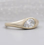 East west pear diamond ring with smooth bezel setting