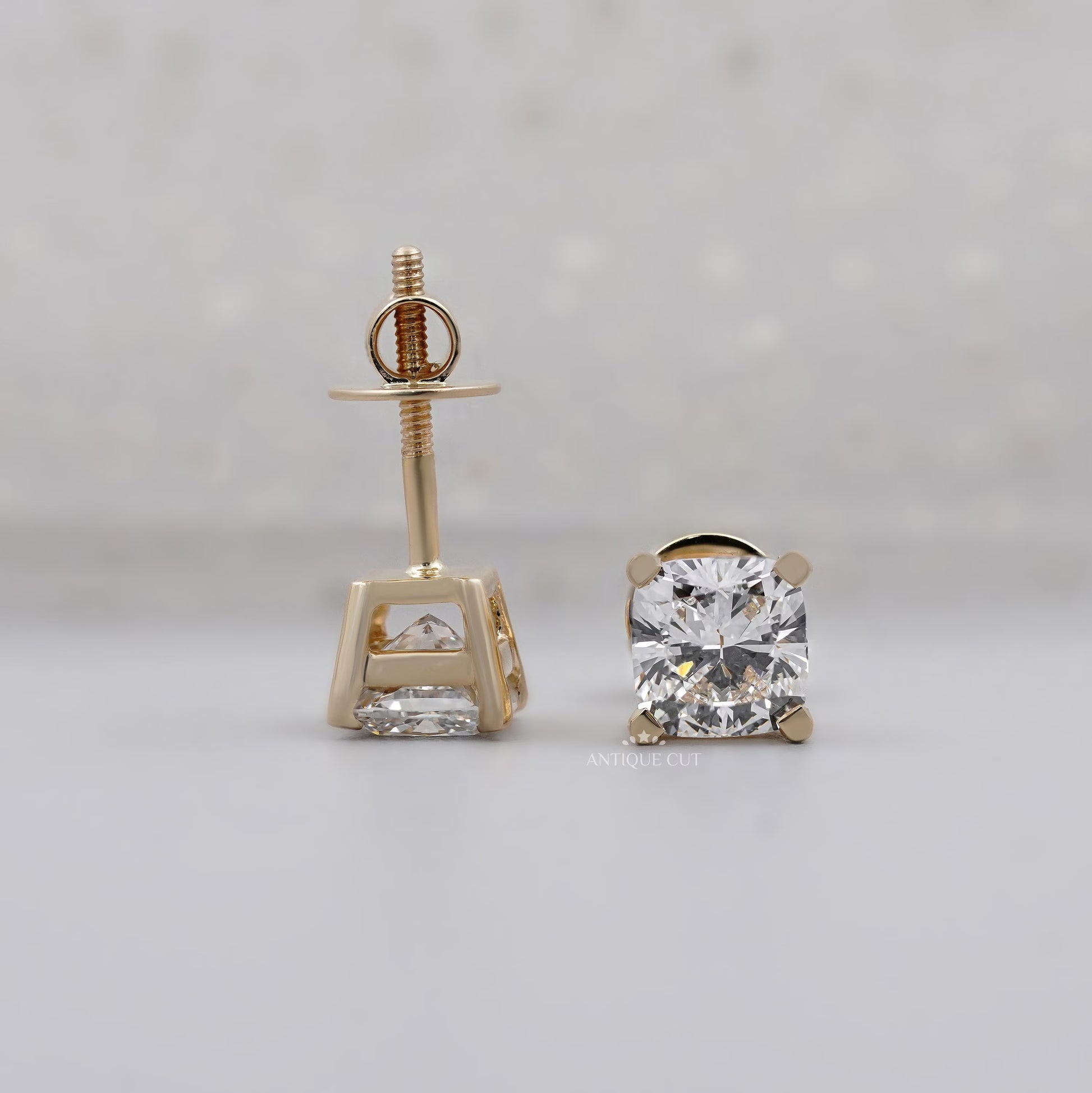 Solitaire cushion diamond stud earrings