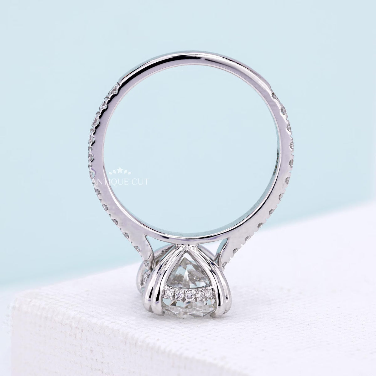Oval cut diamond ring with elegant marquise side stone details
