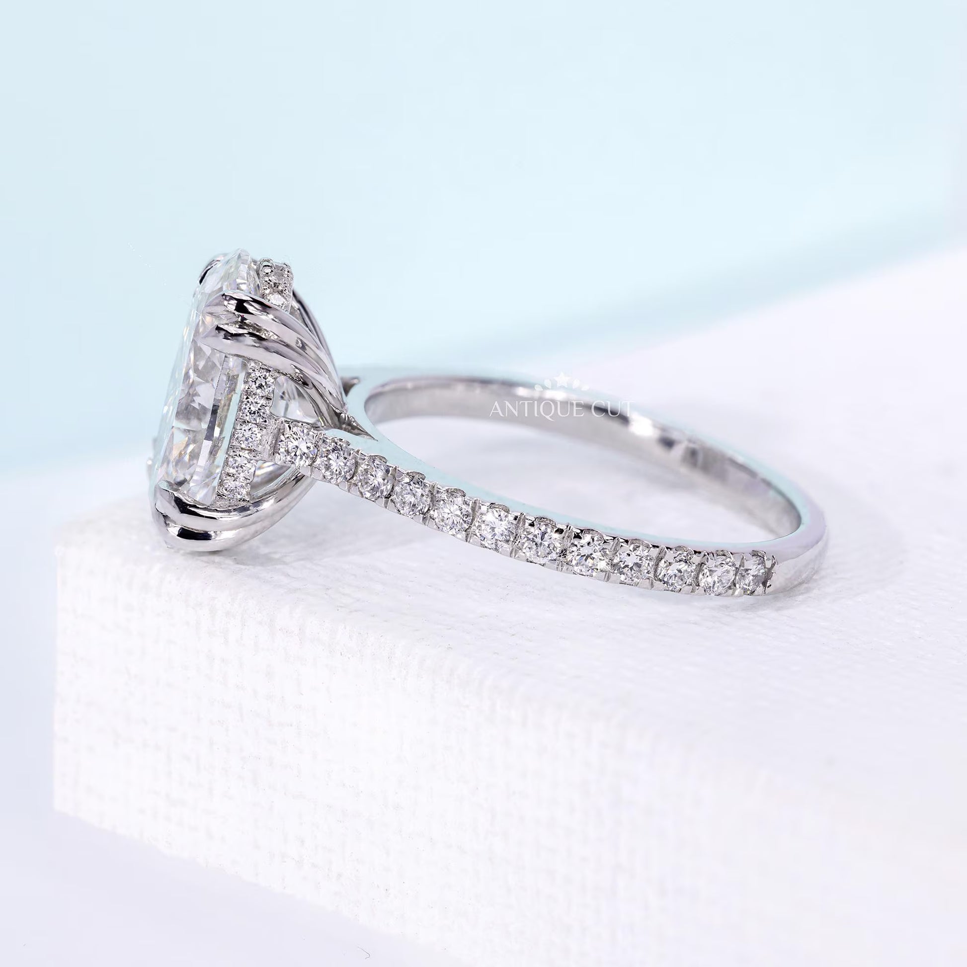 IGI certified oval cut diamond engagement ring with unique side accents
